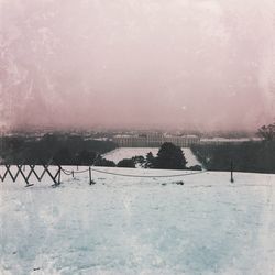 Scenic view of frozen lake against sky during winter