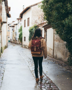 Female traveler walking in old town