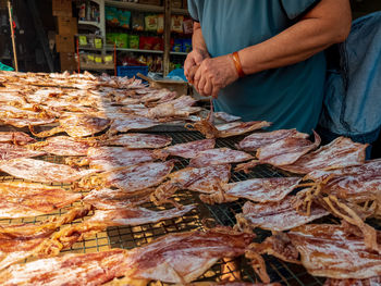 Row of dried squid for sale at the shop.