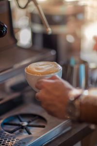 Close-up of coffee cup on table at cafe