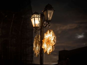Low angle view of illuminated light bulb