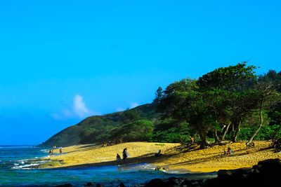 Scenic view of mountains against blue sky