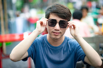 Portrait of young man wearing sunglasses