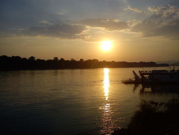 Scenic view of sunset over river