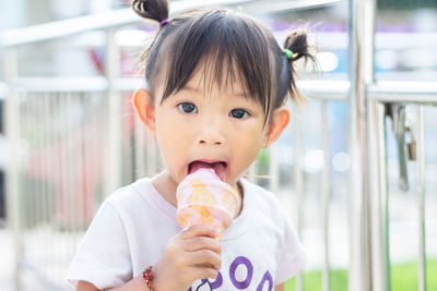 Portrait of girl eating ice cream