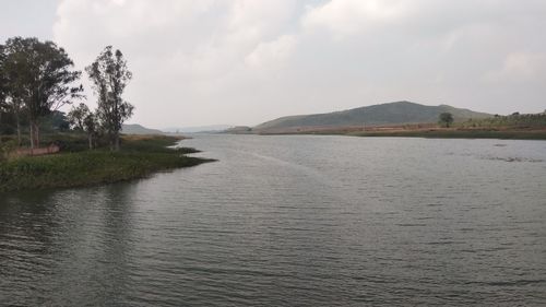 Scenic view of river against sky