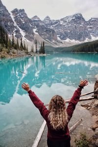 Rear view of woman looking at lake