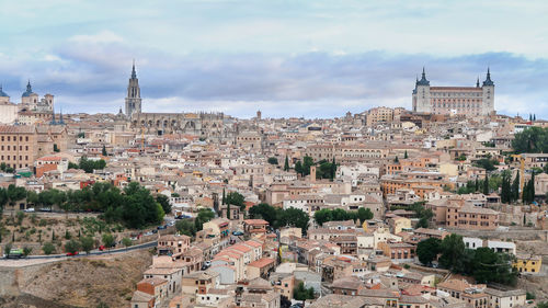 Mesmerizing shot of a beautiful cityscape and ancient castle and cathedral of toledo in spain