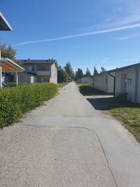 Street amidst buildings against sky