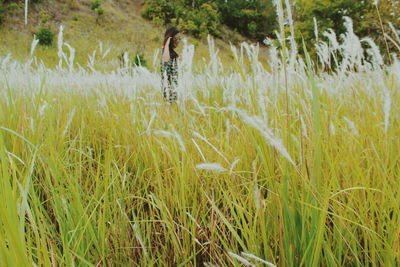 Woman standing in field