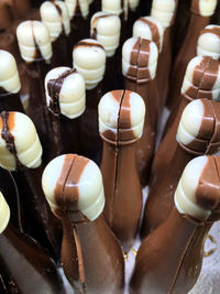 Full frame shot of bottle shape chocolates at store for sale