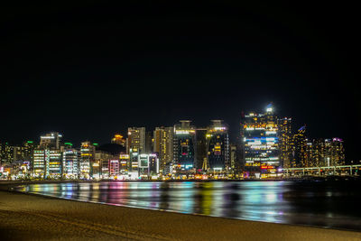 Illuminated buildings in city at night