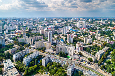 High angle view of modern buildings in city against sky