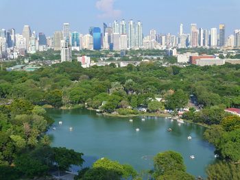 Scenic view of trees and buildings against sky