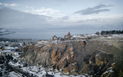 Panoramic view of buildings against sky during winter