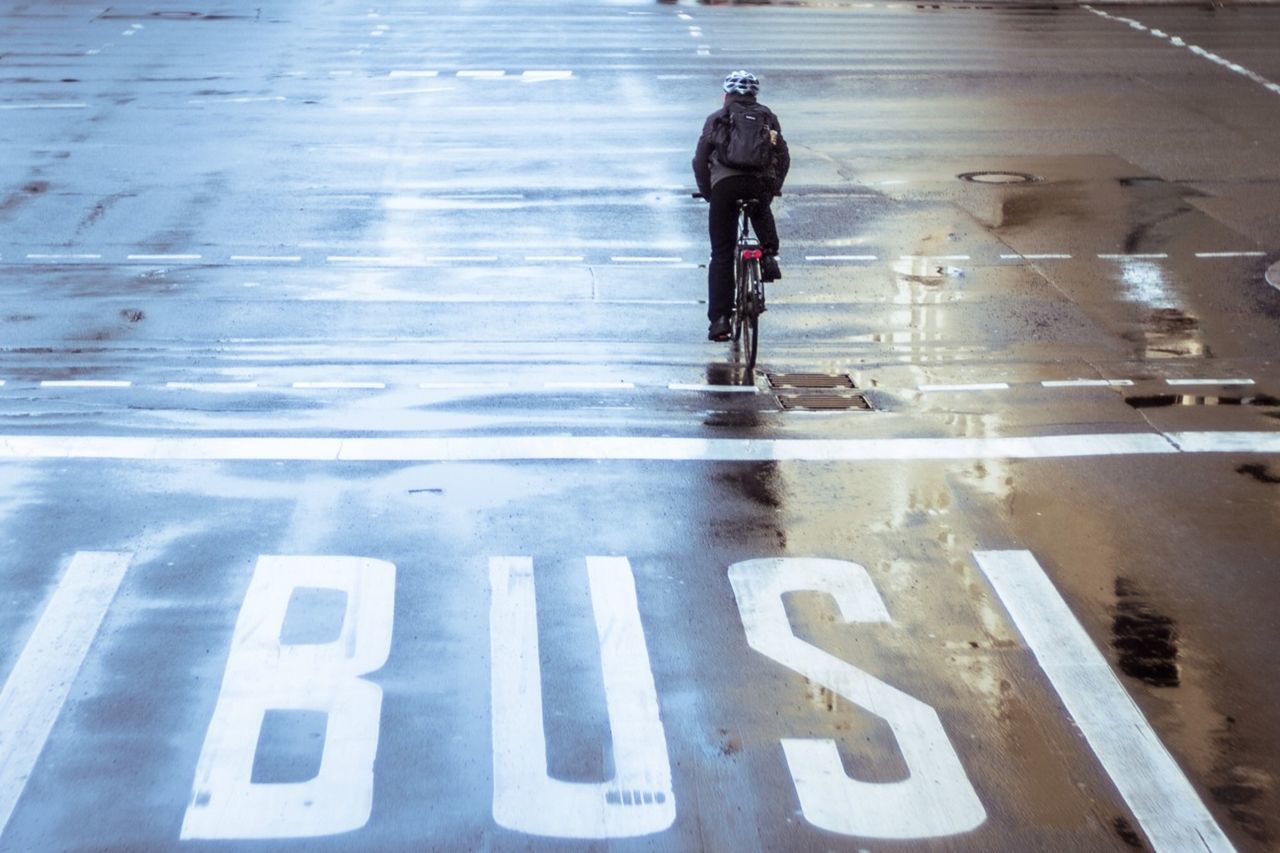 lifestyles, walking, full length, men, street, transportation, rear view, road, road marking, leisure activity, standing, casual clothing, text, on the move, city life, day, communication, high angle view