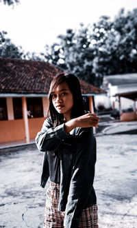 Portrait of young woman standing in winter