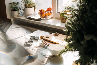 Products and ingredients on kitchen table ready for making christmas gingerbread. lifestyle still