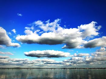 Scenic view of sea against blue sky