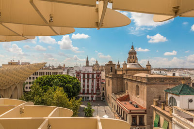 Buildings in city against sky