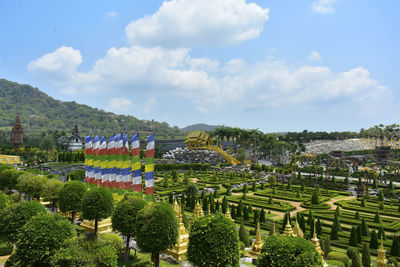 Panoramic view of trees and plants against cloudy sky