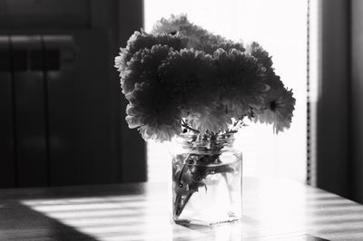 Close-up of glass vase on table at home