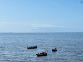 Boat in sea against sky