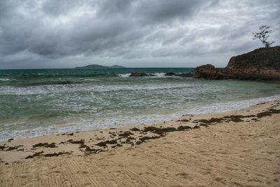 Scenic view of sea against cloudy sky