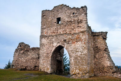 Low angle view of old ruins against sky