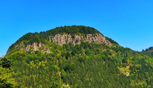 Scenic view of mountain against clear blue sky