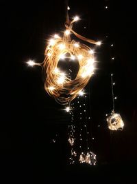 Close-up of illuminated lighting equipment