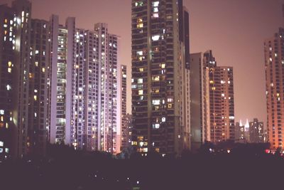 Illuminated buildings in city at night