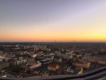 Cityscape against clear sky during sunset