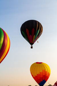 Low angle view of hot air balloons against sky