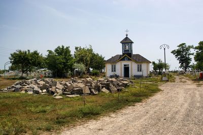 Church amidst trees against sky