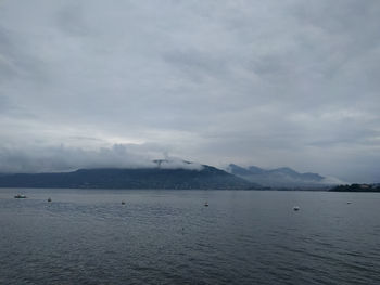 Scenic view of mountains against cloudy sky