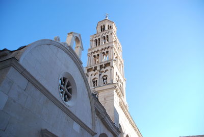 Low angle view of clock tower against sky