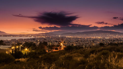 Aerial view of townscape against sky during sunset