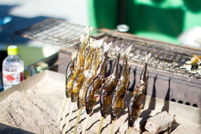 Close-up of fish by barbecue grill