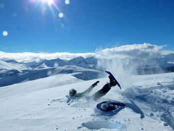 Person fallen on snowcapped mountain