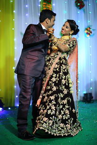 Side view of young couple during wedding ceremony