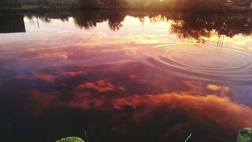 Scenic view of lake at sunset