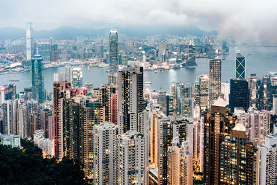 Aerial view of modern buildings in city against sky