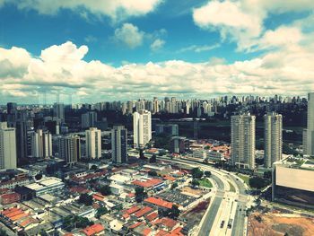 High angle view of city buildings against sky