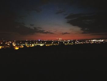 Illuminated cityscape at night