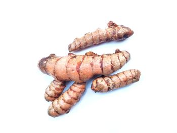 Close-up of bread against white background