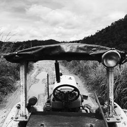 Close-up of motorcycle against sky