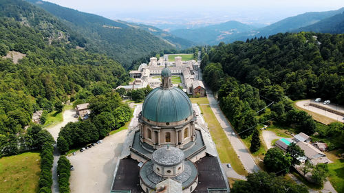 Aero view of beautiful shrine of oropa, facade with dome of the oropa sanctuary located in mountains