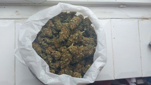 High angle view of white paper in container