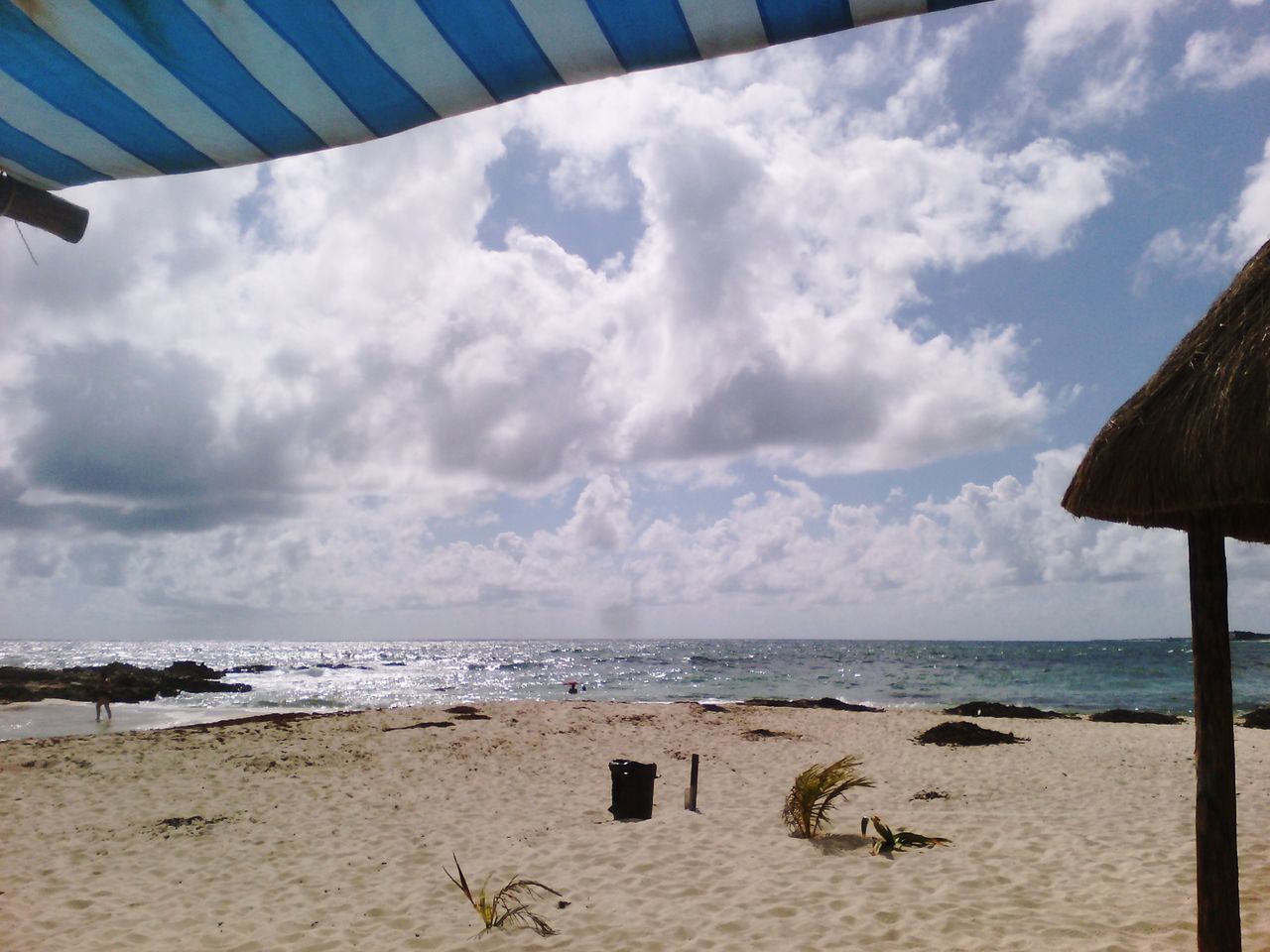 sea, sky, beach, horizon over water, cloud - sky, built structure, sand, shore, water, architecture, cloud, scenics, tranquility, tranquil scene, cloudy, building exterior, beauty in nature, nature, day, outdoors